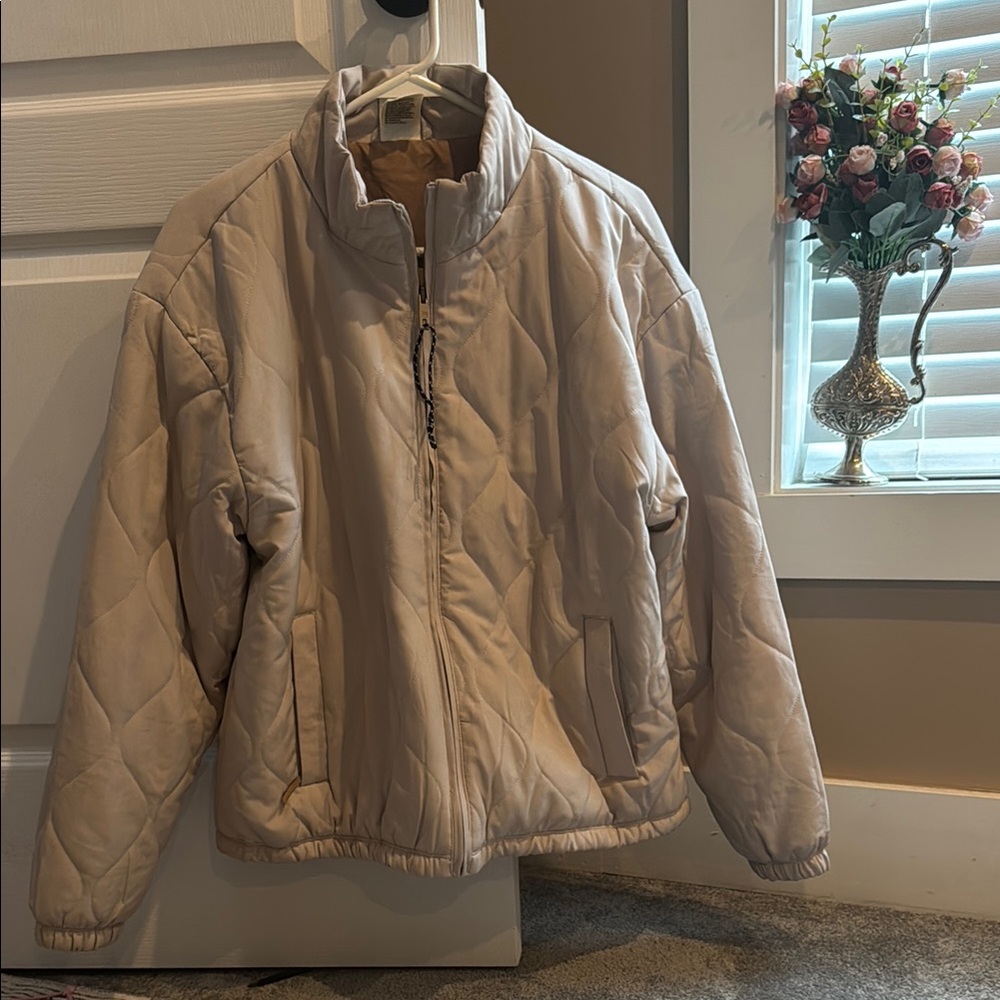 Cream Puffer Jacket with High Collar and Water-Resistant Finish